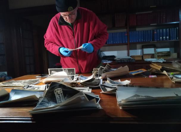 Project lead Auke Slotegraaf examining one of the approximately 600 unique and valuable photographs in the Boyden Observatory collection