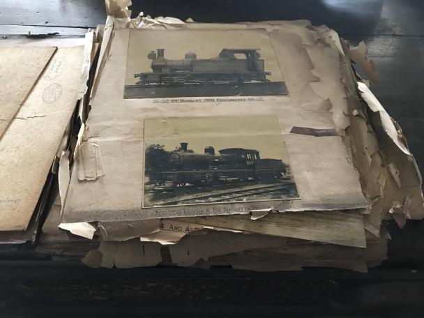 Photo album showing a page containing two locomotives
